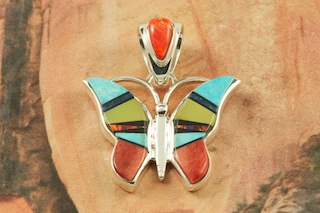 Beautiful Butterfly Pendant featuring Genuine Turquoise, Gaspeite, Spiny Oyster Shell and Blue Lapis inlaid in Sterling Silver. Accented with Fire and Ice Lab Opals. Free 18