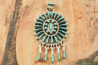 Genuine Sleeping Beauty Turquoise set in Sterling Silver Pendant. Beautiful Neddle Point Design. The Sleeping Beauty Turquoise Mine is located in Gila County, Arizona. Free 18