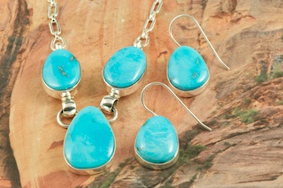 Genuine Castle Dome Turquoise set in Sterling Silver. Stunning Necklace and Earrings Set. The Castle Dome Turquoise Mine is located about 30 miles from the Sleeping Beauty Mine, near Globe, Arizona. The Castle Dome Mine has not been in operation since the early 1970s. The photo is of the jewelry you will be receiving. Created by Navajo Artist Tony Garcia. Signed by the artist.