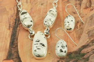 Genuine White Buffalo Turquoise Stones set in Sterling Silver. This Beautiful Stone is formed from the minerals Calcite and Iron. It is mined near Tonopah Nevada. Stunning Necklace and Earrings Set. Created by Navajo Artist Tony Garcia. Signed by the artist.