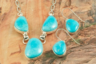 Genuine Castle Dome Turquoise set in Sterling Silver. Stunning Necklace and Earrings Set. The Castle Dome Turquoise Mine is located about 30 miles from the Sleeping Beauty Mine, near Globe, Arizona. The Castle Dome Mine has not been in operation since the early 1970s. The photo is of the jewelry you will be receiving. Created by Navajo Artist Tony Garcia. Signed by the artist.