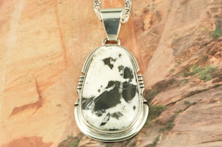 Stunning Pendant featuring Genuine White Buffalo Turquoise  set in Sterling Silver. This Beautiful Stone is formed from the minerals Calcite and Iron. It is mined near Tonopah Nevada. Free 18