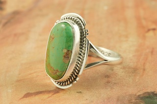 Genuine Manassa Turquoise set in Sterling Silver Ring. This Turquoise is also referred to as King�s Manassa Turquoise. The Manassa Turquoise mine is located in Manassa, Conejos County, Colorado. Created by Navajo Artist Kathy Yazzie. Signed by the artist.