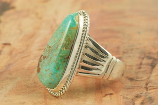 Genuine Manassa Turquoise set in Sterling Silver Ring. This Turquoise is also referred to as King�s Manassa Turquoise. The Manassa Turquoise mine is located in Manassa, Conejos County, Colorado. Created by Navajo Artist Tony Garcia. Signed.