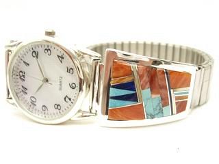 Genuine Spiny Oyster Shell, Turquoise and Blue Lapis inlaid between ribbons of Sterling Silver. Beautiful Mother of Pearl Accents. Mens quartz watch with expandable band. Designed by Navajo Artist Calvin Begay. Signed.