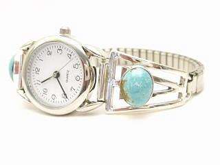 Genuine Number 8 Mine Turquoise set in Sterling Silver Watch Tips. Created by Navajo Artist Freddy Charley. The Number 8 mine is located in Eureka County Nevada. Since 1976 there has been no Number 8 Turquoise mined. There is however, an existing stock pile that Mr. Dowell Ward, the last owner of the Number 8 mine, had stocked away for later sorting. The Turquoise is a collector's item--because once the reserve is gone there will be no more material released onto the market. The Gold Mining Company owns the claim to the Number 8 mine and it has been swallowed up by the gold mining operations. This is some of the last Number 8 Turquoise to be had and will be a great addition to your collection. 
