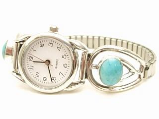 Genuine Sleeping Beauty Turquoise set in Sterling Silver Watch Tips.  Ladies quartz watch with expandable watch band. Created by Navajo Artist Larson Lee. Signed.