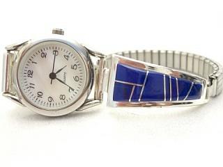 Genuine Blue Lapis inlaid between ribbons of Sterling Silver. Ladies Watch Tips with Expandable Band. Designed by Navajo Artist Calvin Begay. Signed.