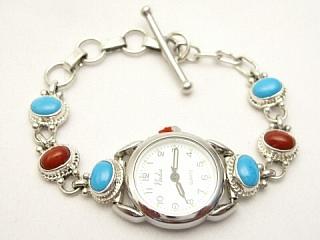 Genuine Sleeping Beauty Turquoise and Coral set in Sterling Silver. The Sleeping Beauty Turquoise mine is located in Gila County, Arizona. Ladies Watch Bracelet Created by Navajo Artist Geneva Chavez.
