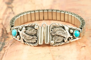 Genuine Sleeping Beauty Turquoise set in Sterling Silver. Beautiful Eagle Design in Sterling Silver. Ladies Watch Tips with expandable band. Created by Navajo Artist Larson Lee.