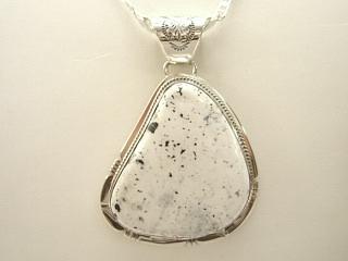 White Buffalo Turquoise set in Sterling Silver Pendant. This Beautiful Stone is formed from the minerals Calcite and Iron. It is mined near Tonopah Nevada. Free 18