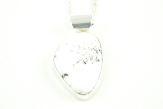 White Buffalo Turquoise set in Sterling Silver Pendant. This Beautiful Stone is formed from the minerals Calcite and Iron. It is mined near Tonopah Nevada. Free 18