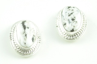 White Buffalo Turquoise in Sterling Silver French Wire Earrings. 
 This Beautiful Stone is formed from the minerals Calcite and Iron. It is mined near Tonopah Nevada. Created by Navajo Artist Jake Sampson. Signed. 
