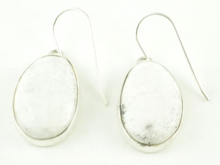 White Buffalo Turquoise set in Sterling Silver French Wire Earrings. 
This Beautiful Stone is formed from the minerals Calcite and Iron. It is mined near Tonopah Nevada. Created by Navajo Artist Jake Sampson. Signed. 
