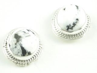 White Buffalo Turquoise set in Sterling Silver French Wire Earrings. This Beautiful Stone is formed from the minerals Calcite and Iron. It is mined near Tonopah Nevada. Created by Navajo Artist Kathy Yazzie. Signed.
