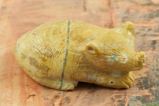 Zuni Pig Fetish created by Zuni Artist Randy Lucio. Carved from Picasso Marble with Turquoise eyes.