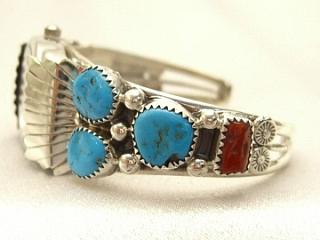 Authentic Native American Jewelry. 6 Beautiful Sleeping Beauty Stones and 2 of Blood Red Coral set in Sterling Silver Ladies Watch Bracelet. Created by Navajo Artist Charlene Yazzie.