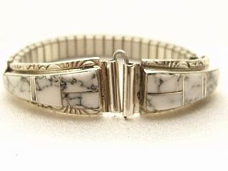 Genuine Howlite known as White Buffalo Turquoise inlaid in Sterling Silver. Ladies Watch Tips with expandable band. Created by Navajo Artist Steve Francisco. Signed SF.