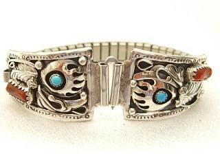 Genuine Turquoise and Coral set in Sterling Silver. Watch Tips with expandable band. Beautiful Bear Paw and Leaf Design. Created by Navajo Artist Mike Arviso.