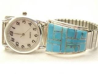 Genuine Turquoise with Fire and Ice Lab Opal accents inlaid in Sterling Silver Watch Tips.   Mens watch with an expandable band. Signed by the Navajo Artist Denny.