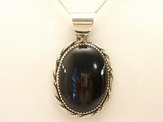 Genuine Black Onyx set in Sterling Silver Pendant. Free 18" Sterling Silver Chain. Created by Navajo Artist Ida McCray. Signed