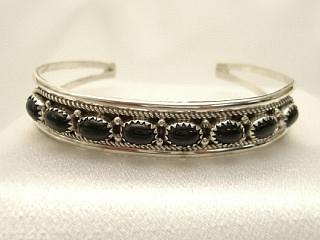 8 Genuine Black Onyx Stones set in Sterling Silver Bracelet. Created by Navajo Artist Harry Spencer. Signed.