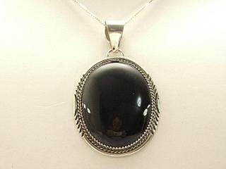 Genuine Onyx set in Sterling Silver Pendant. Free 18" Sterling Silver Chain with purchase of pendant. Created by Navajo Artist Herman Lee. Signed H.