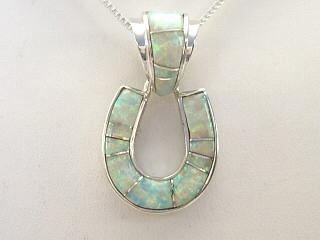 Fire & Ice Lab Opal inlaid between ribbons of Sterling Silver. Beautiful Horseshoe Pendant. Free 18" Sterling Silver Chain with purchase. Calvin Begay Design