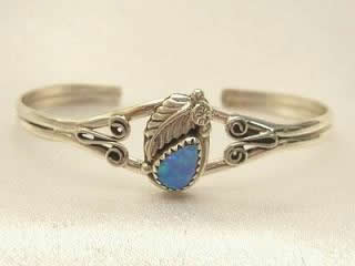 Blue Fire & Ice Lab Opal set in Sterling Silver Bracelet. Sterling Silver Leaf Design. Created by Navajo Artist Ida McCray. Signed IMC.