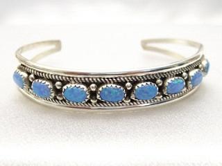 8 Beautiful Blue Lab Opal Cabachons set in Sterling Silver Bracelet. Created by Navajo Artist Dixie Frank.
