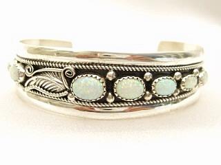 7 Beautiful Fire & Ice Lab Opals set in Sterling Silver Bracelet. Created by Navajo Artist Edision Etsitty. Signed E.