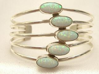 5 Beautiful Fire and Ice Lab Opal Stones set in Sterling Silver Bracelet. Created by Navajo Artist James Morris.