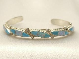 Genuine Turquoise and Fire and Ice Lab Opals set in Sterling Silver Bracelet. Created by Zuni Artist Leola Nastacio. Signed.