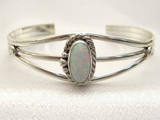 Beautiful Fire & Ice Lab Opal set in Sterling Silver Bracelet. Created by Navajo Artist L. Ganato.