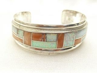 Genuine Spiny Oyster Shell and Beautiful Fire and Ice Lab Opals set in Sterling Silver Bracelet. Created by Zuni Artist Rickell Booqua.