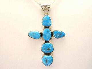 Genuine Sleeping Beauty Turquoise set in Sterling Silver Cross Pendant. FREE 18" Sterling Silver Chain with purchase. Created by Navajo Artist Jerry Marlano. Signed J.
