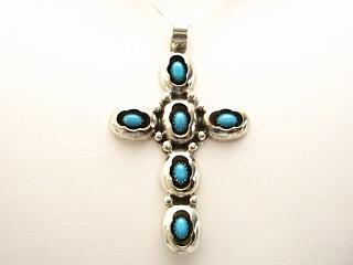 Genuine Sleeping Beauty Turquoise set in Sterling Silver Cross. FREE 18" Sterling Silver Chain with purchase of Pendant. Created by Navajo Artist Fabian Garcia.