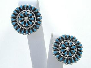 Genuine Turquoise set in Sterling Silver. Clip on Earrings Beautiful petite point design. Created by Zuni Artist Yatsattie. Signed.