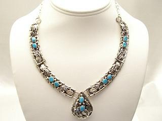Genuine Turquoise set in Sterling Silver Necklace with Sterling Silver Chain & Clasp. Created by Navajo Artist Rita Dawes. Signed D.
