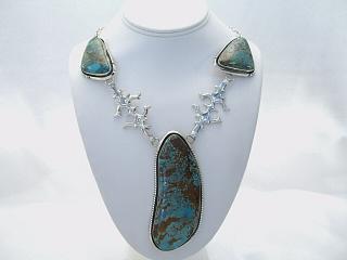Genuine Morenci Turquoise set in Sterling Silver Necklace. Sterling Silver Chain & Clasp. This Necklace has Beautiful Stones with Stunning Matrix. Created by Navajo Artist Harry Spencer. Signed.