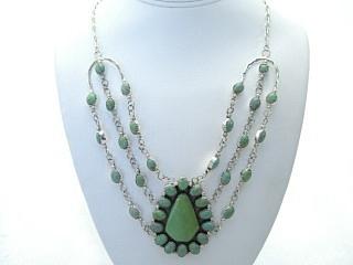 Genuine Mohave Turquoise set in Sterling Silver. Necklace with Sterling Silver Chain and Clasp. Created by Navajo Artist  Rita Dawes. Signed D.