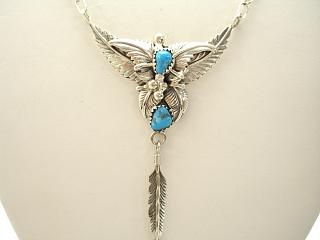 Authentic Native American Jewelry. Genuine Turquoise set in Sterling Silver Necklace with Sterling Silver Chain and Clasp. Beautiful Leaf and Feather Design. Created by Navajo Artist Rita Dawes.