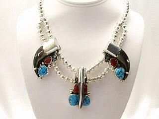 Genuine Turquoise & Coral with Real Bear Claws set in Sterling Silver.  Necklace with Sterling Silver Beads & Clasp. Created by Navajo Artist Fred Peters