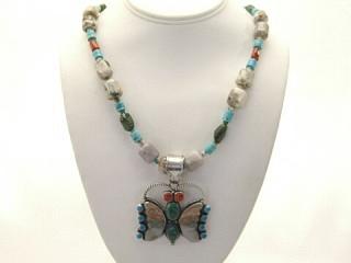 Genuine Sleeping Beauty Turquoise, Nevada Turquoise, Coral and Picture Jasper set in Sterling Silver Butterfly Pendant. The Butterfly Pendant is on a 25" Necklace featuring Picture Jasper with Coral and Turquoise accents. Sterling Silver Cones, Clasp and Extender. Created by Zuni Artist Leonard Mitza.