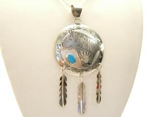 Genuine Turquoise set in Sterling Silver Pendant. Beautiful Horse & Hand with Heartline Design. 3 Sterling Silver Feathers. Free 18" Sterling Silver Chain with Purchase of Pendant. Created by Navajo Artist Ricky Reeder. Signed.