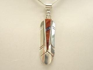 Genuine Spiny Oyster Shell and Jet inlaid between ribbons of Sterling Silver. Beautiful Feather Design Pendant. Free 18" Sterling Silver Chain with purchase of Pendant. Created by Navajo Artist Marilyn Yazzie. Signed YZ.