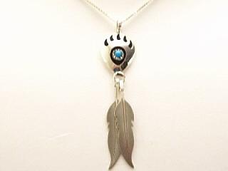 Genuine Turquoise set in Sterling Silver Pendant. Free 18" Sterling Silver Chain with Purchase of Pendant. Created by Navajo Artist Virginia Johnson.