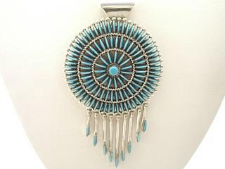 Authentic Native American Jewelry. Genuine Sleeping Beauty Turquoise set in Sterling Silver Pendant. Beautiful Petit Point Design. Free 18" Sterling Silver Chain with Purchase of Pendant. Created by Zuni Artist Eva Wyaco. Signed.