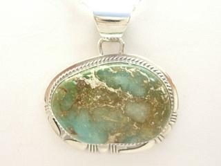 Genuine Emerald Valley Turquoise Stone set in Sterling Silver Pendant. Free 18" Sterling Silver Chain with Purchase of Pendant. Created by Navajo Artist Phillip Sanchez. Signed.