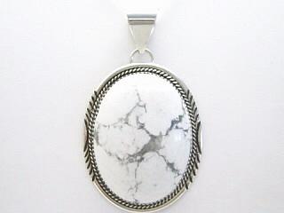Genuine Howlite known as White Buffalo Turquoise set in Sterling Silver Pendant. FREE 18" Sterling Silver Chain with purchase. Created by Navajo Artist Herman Lee. Signed.